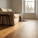 Solid white oak plank hardwood floor installed in a renovated living room with warm daylight