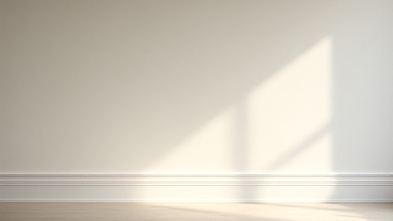 Photorealistic editorial image of a finished room with white baseboards and shoe molding